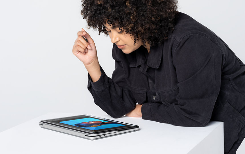 Adult female with Laptop Studio working in Adobe Photoshop