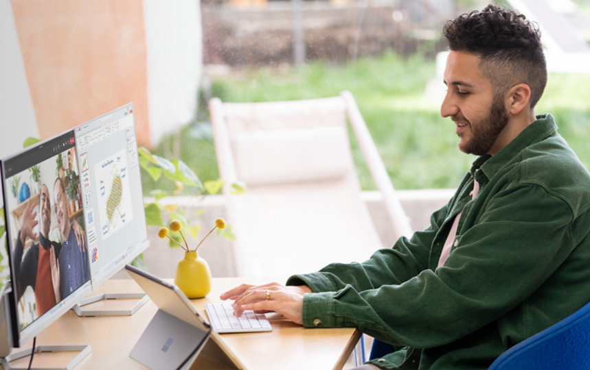 A person working on Surface Laptop Studio