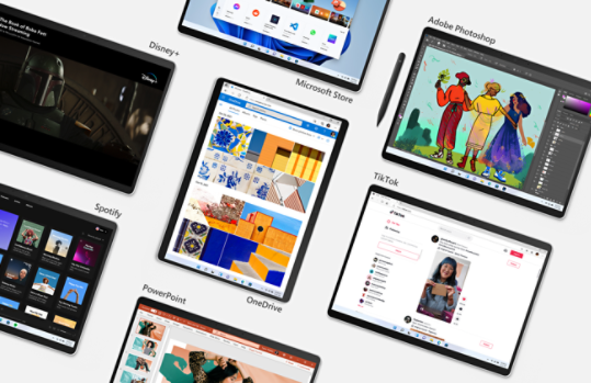 Imagen aérea de dispositivos Surface Pro X mostrando distintas apps: Microsoft Store, Adobe Photoshop, Disney+, OneDrive, TikTok, Spotify, PowerPoint.