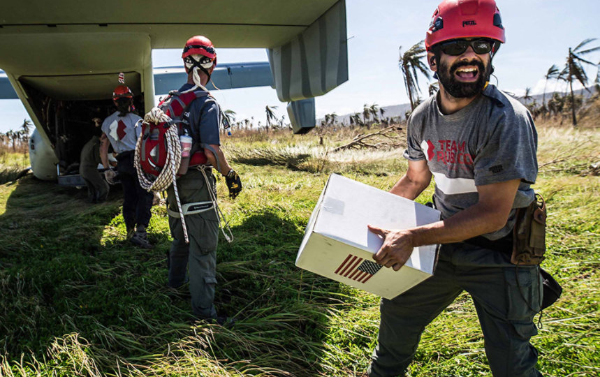 The people of Team Rubicon distribute supplies in a disaster zone.