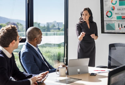 Three people meeting in a conference room