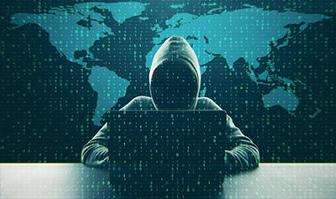 Illustration of a person wearing a hoodie with their face obscured sitting in front of a laptop with a world map in the background and lines of code over the entire image
