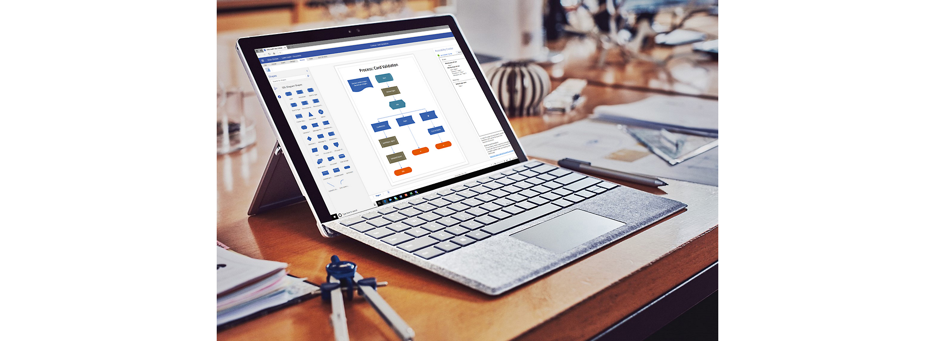 A Surface laptop with a flowchart open in Visio