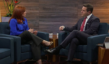 Still image from video showing Alex Bradley and Theresa Payton sitting across from each other having a conversation.