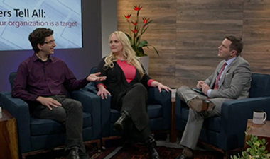 Still image from video showing Alex Bradley, Jennifer Arcuri, and Jeff Moss sitting across from each other having a conversation.