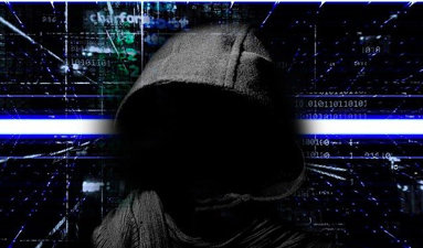 Person with face obscured shown from the chest up wearing a hoodie while vertical and horizontal lines and computer code glow in the background