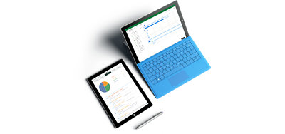 Overhead view of a pen, a Surface tablet, and a Surface laptop with a blue keyboard. Microsoft Project is open on both screens