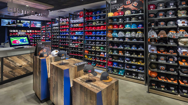 A baseball store with many hats on display.