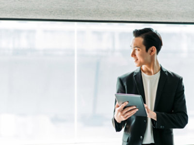 A person holding a tablet.