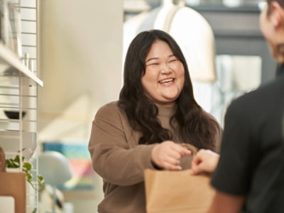 A woman talking to another woman.