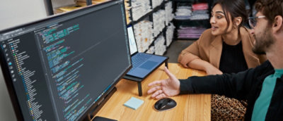 A person sitting at a desk with a computer.