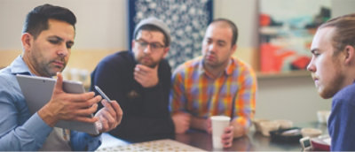 A group of men sitting at a table