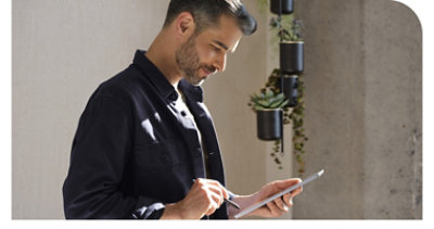 A person using a tablet and pen.