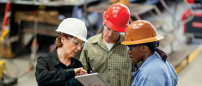 A group of people wearing hard hats.