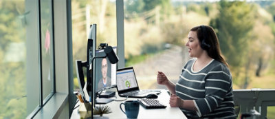 A person sitting at a desk with a computer