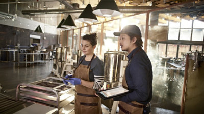A group of people in aprons.