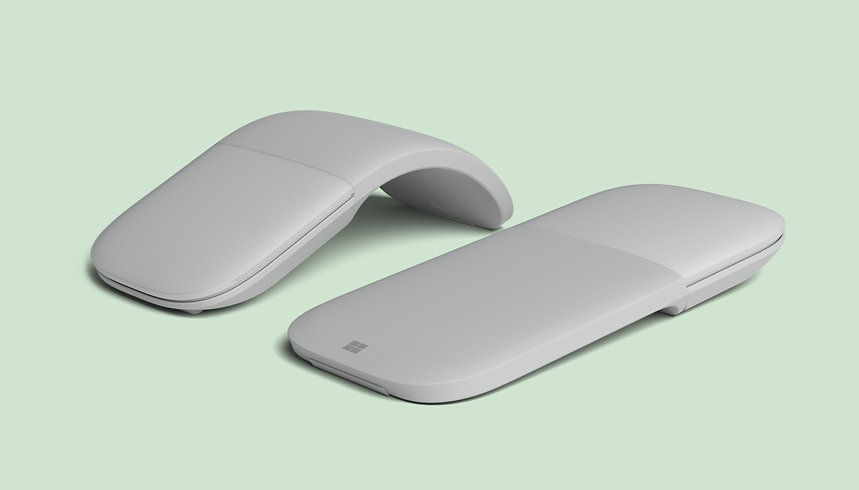 A Surface Arc Mouse for Business in the curved position and a Surface Arc Mouse for Business in the flat position.