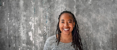 A woman smiling at the camera.