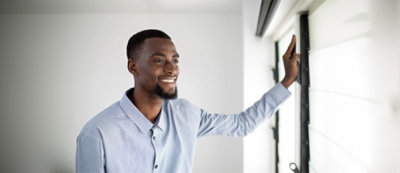 A man holding a white board.