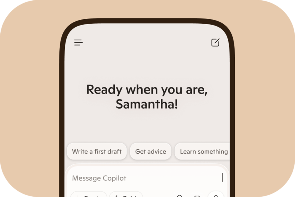 Copilot app on a mobile phone with text saying “Ready when you are, Samantha!” on a light orange background.
