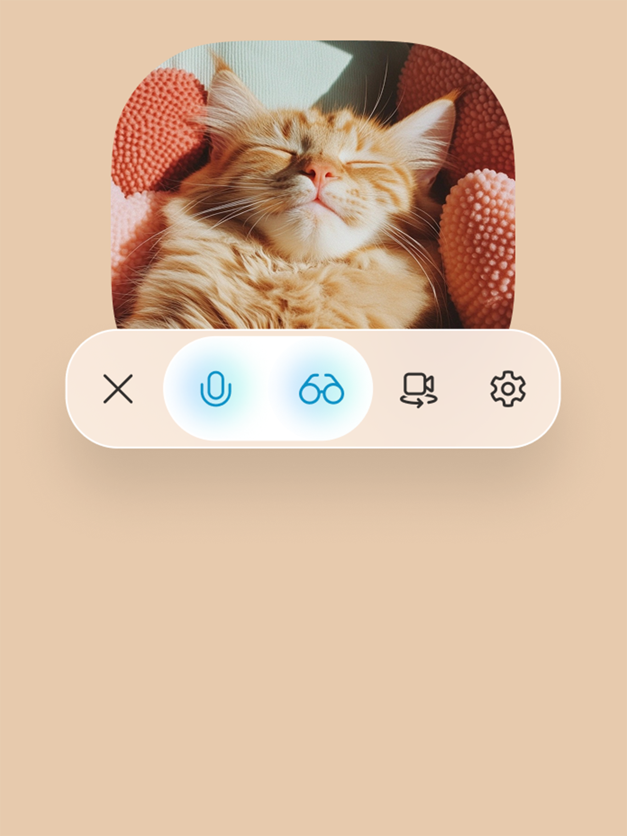 Image of a relaxed orange kitten above a row of Copilot action buttons, with the microphone and glasses buttons selected for Copilot Vision