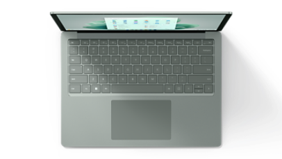 A Surface laptop is shown from the top down to showcase the keyboard