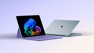 Two Surface devices, one showing the Copilot bloom
