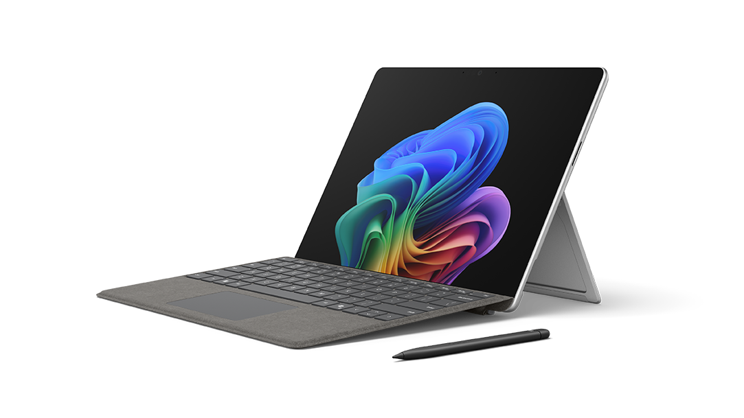 A Surface Pro Copilot+ PC with an attachable Surface Pro keyboard and Surface Slim Pen