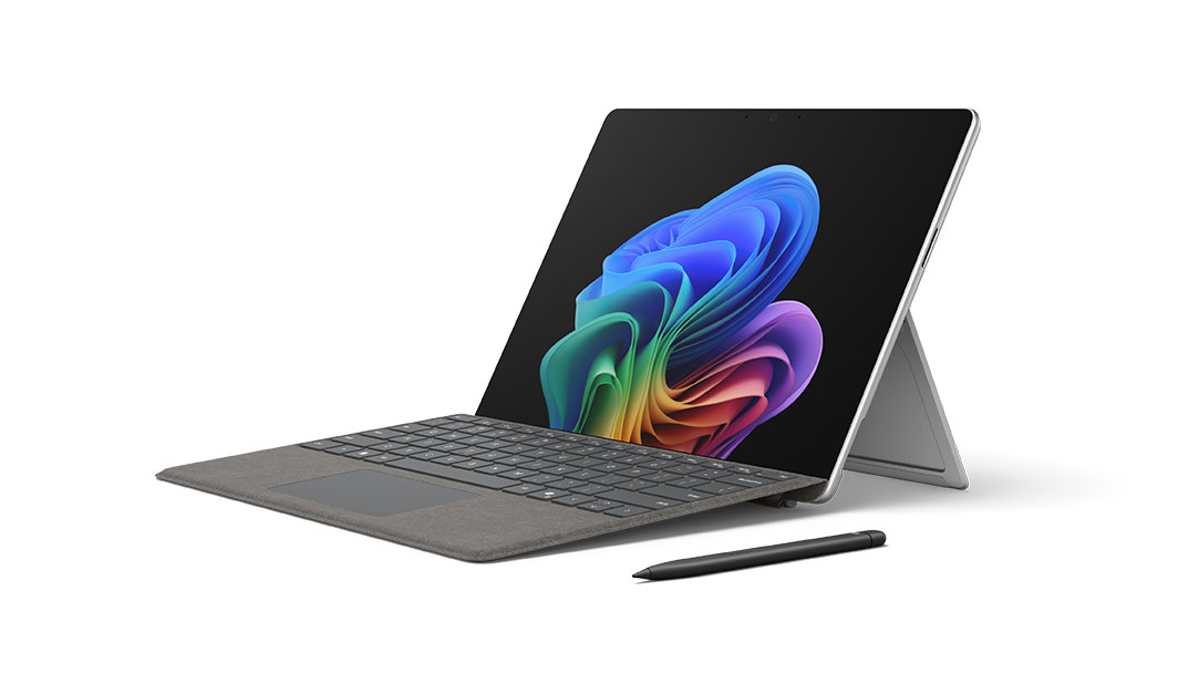 A Surface Pro Copilot+ PC with an attachable Surface Pro keyboard and Surface Slim Pen