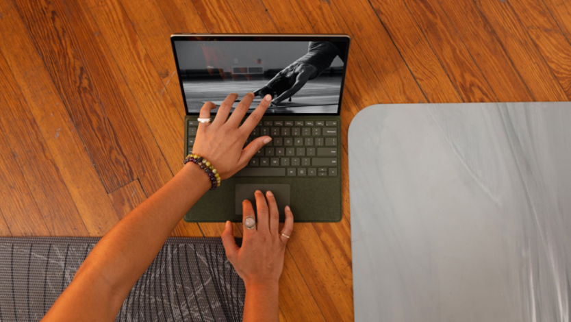 A Surface laptop on a wood floor