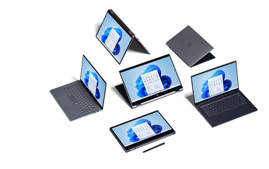 Eine Auswahl von Windows 11-Notebooks und 2-in-1-PCs vor einem grauen Hintergrund.