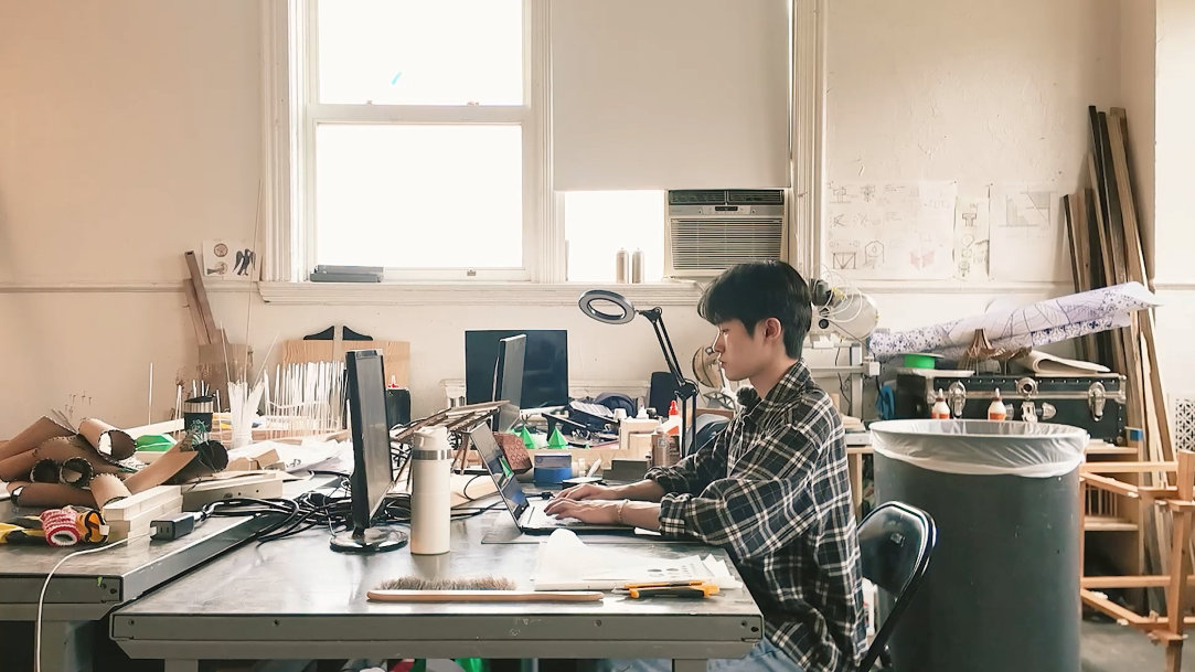 A creator working in his office space on a Windows PC