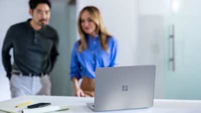 A female and male student using a Surface Laptop Copilot+ PC