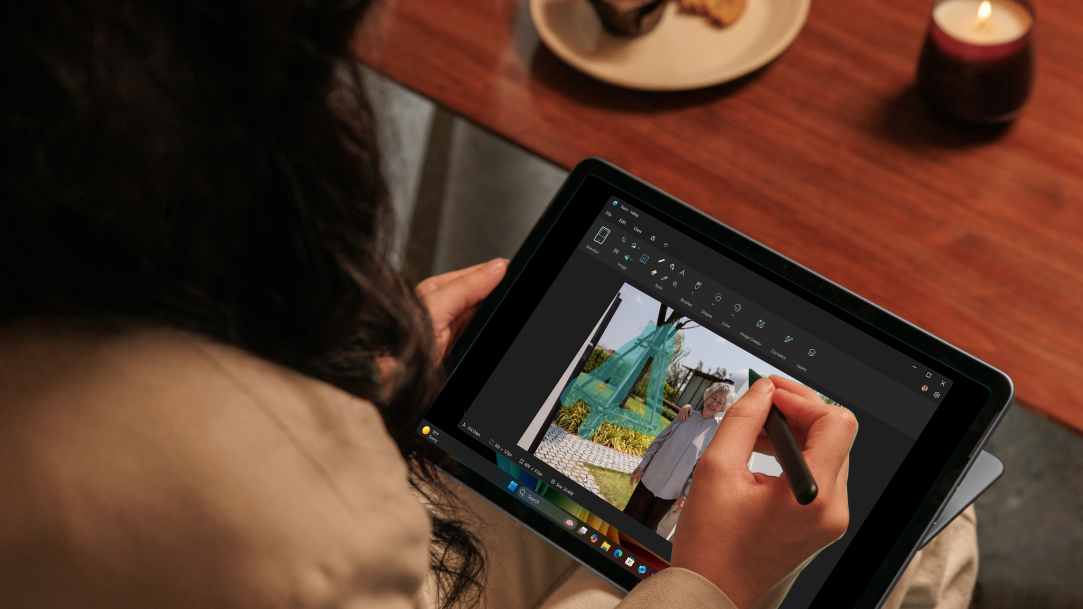 A graphic designer illustrating on a Surface Pro 2-in-1