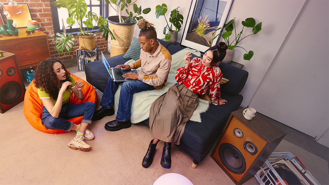 A group of friends discuss how to do a digital detox with a Copilot+ PC