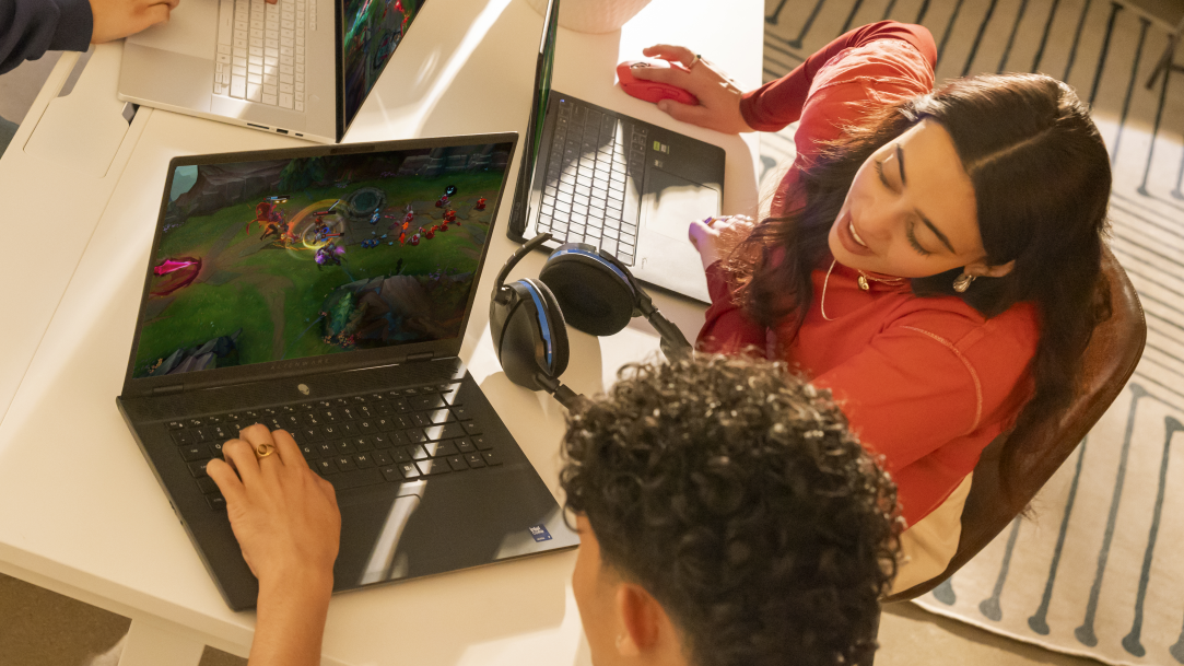 A group of young adults gaming on laptops