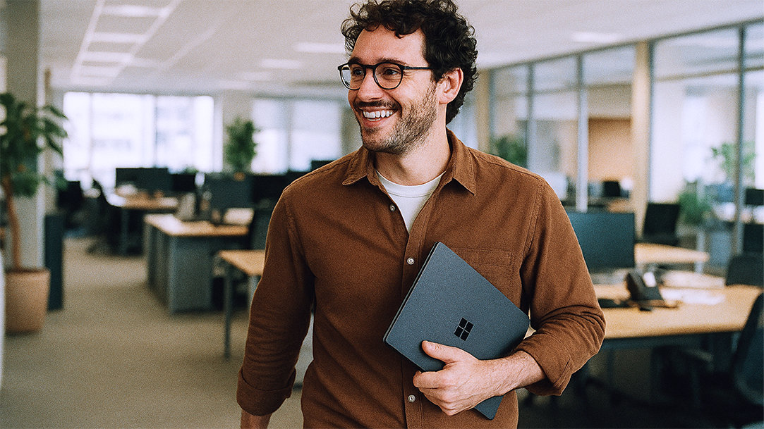 A happy office worker walking through an office space after using AI automation to finish his tasks early