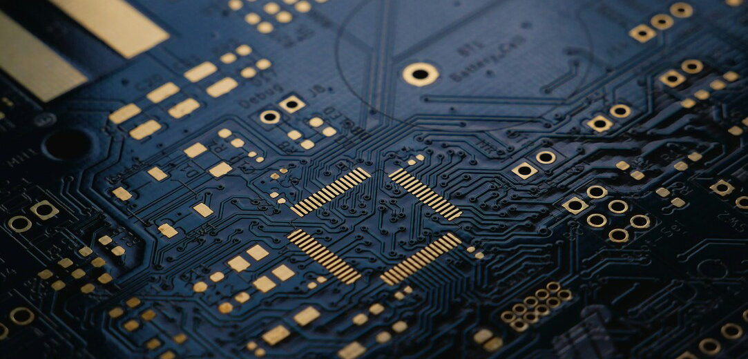  low exposure photograph of an unsoldered Printed Circuit Board (PCB) with ENIG (Gold) finish