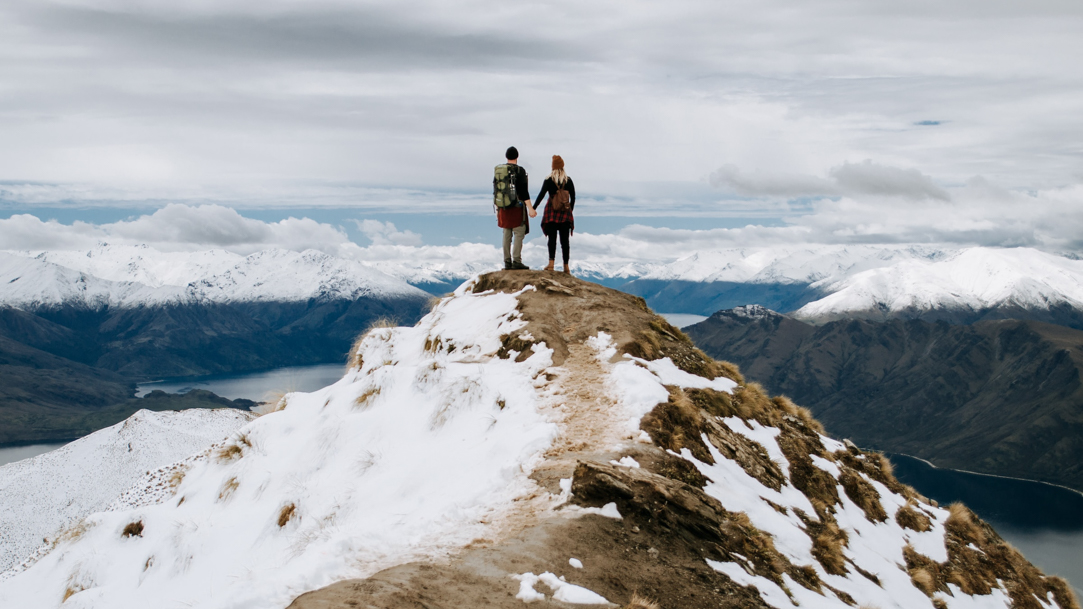 A man and a woman on a mountaintop