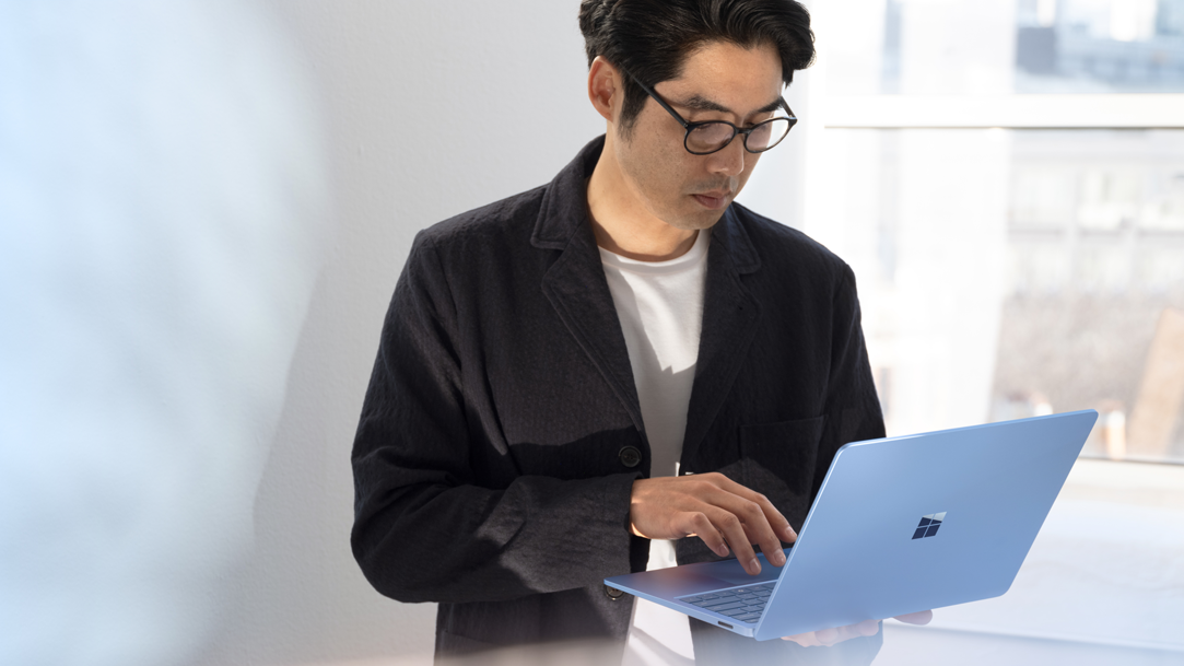 A person checking their email on a Surface Laptop