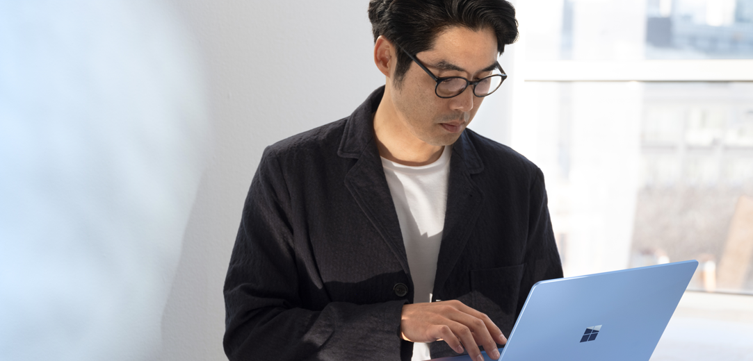 A person checking their email on a Surface Laptop