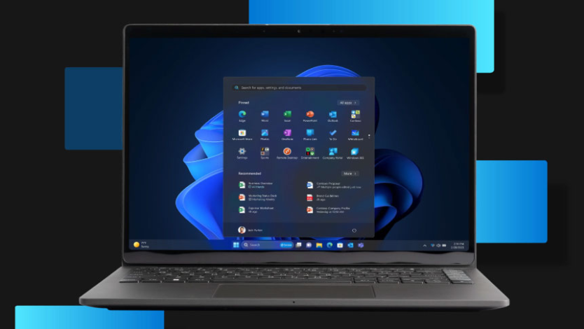 A photo of a Windows 11 Pro device merged into a background graphic