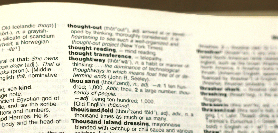 A photo of a dictionary page open to the entries starting with “th”