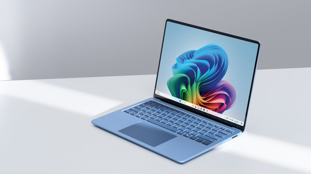 A sapphire Surface Laptop 7ᵗʰ Edition with a Windows 11 screen