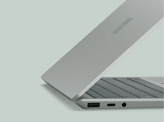 A side view of a Surface Laptop Go 2 three-quarters of the way open