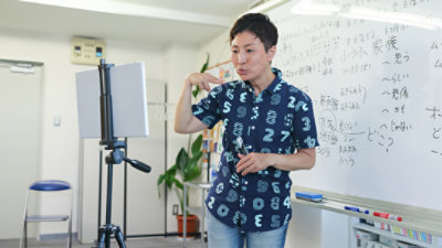 A sign language instructor creating a video