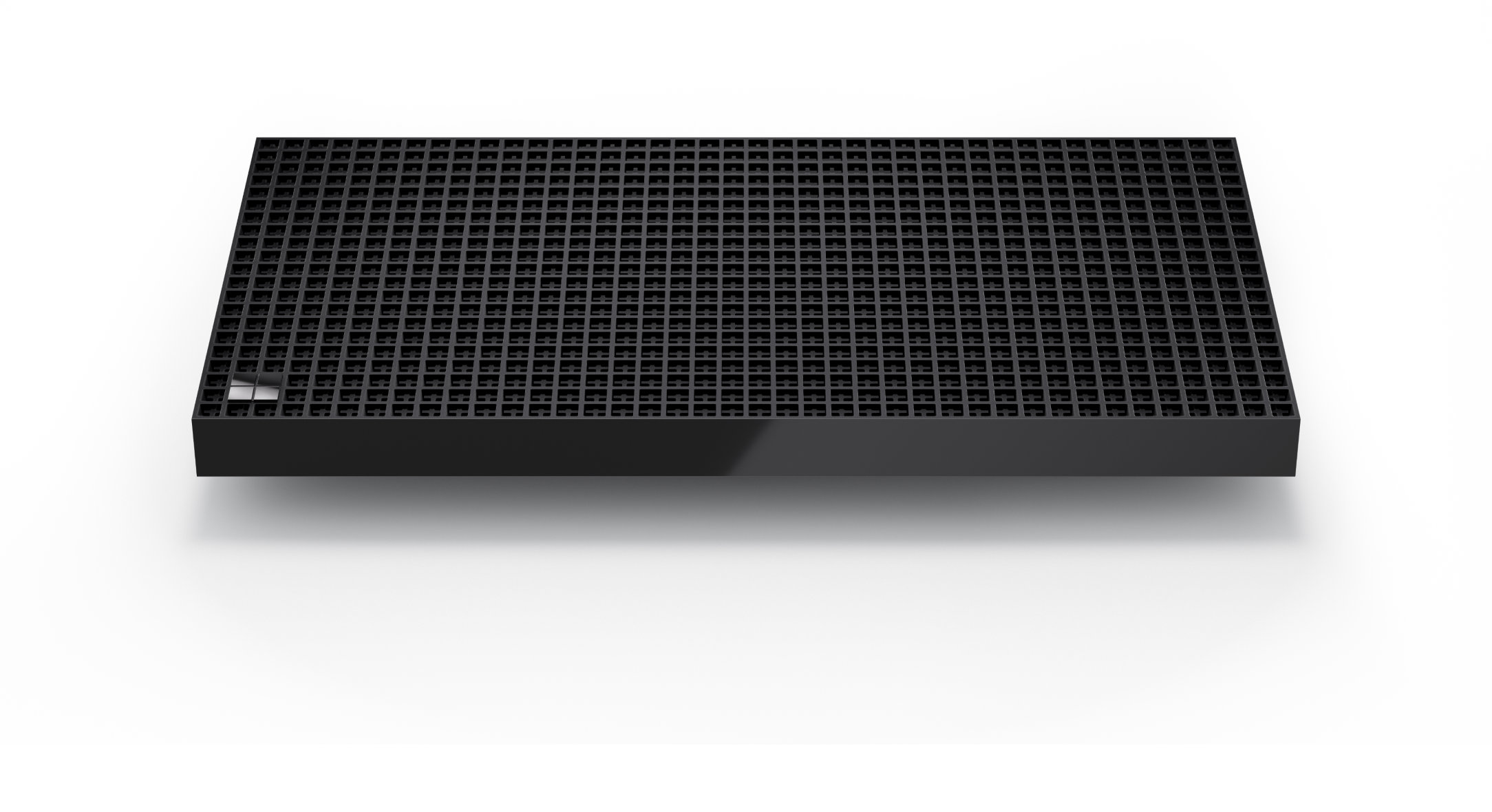 Black rectangular device with perforated top surface, shown at an angle on a light background