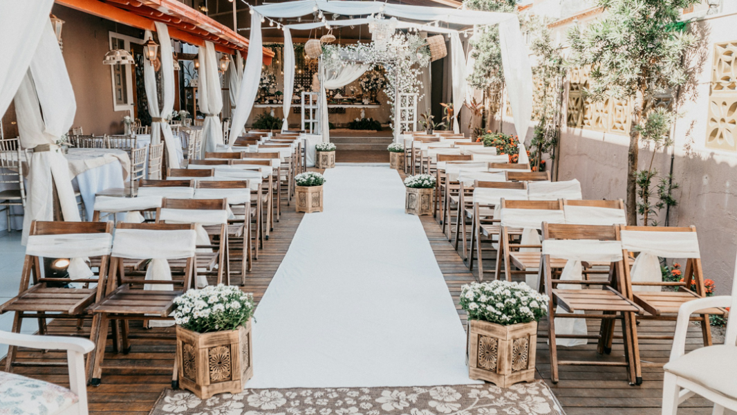 A wedding ceremony with chairs and decorations