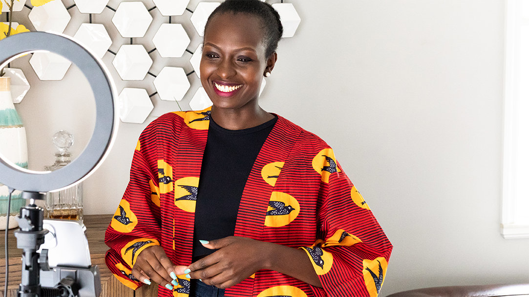 A woman content creator shooting a video at home