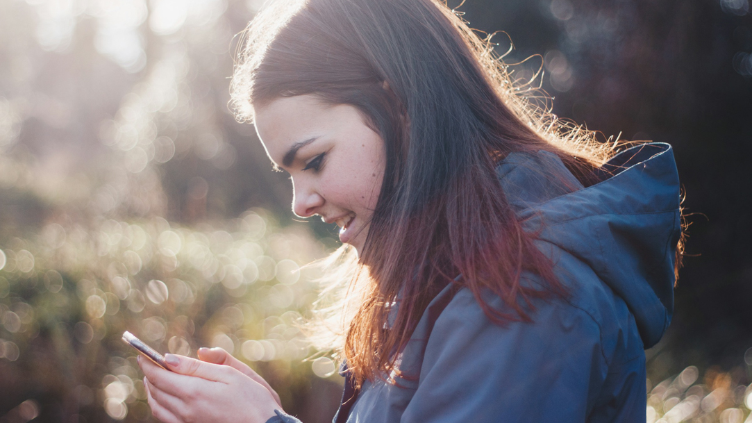 A woman looking at her phone